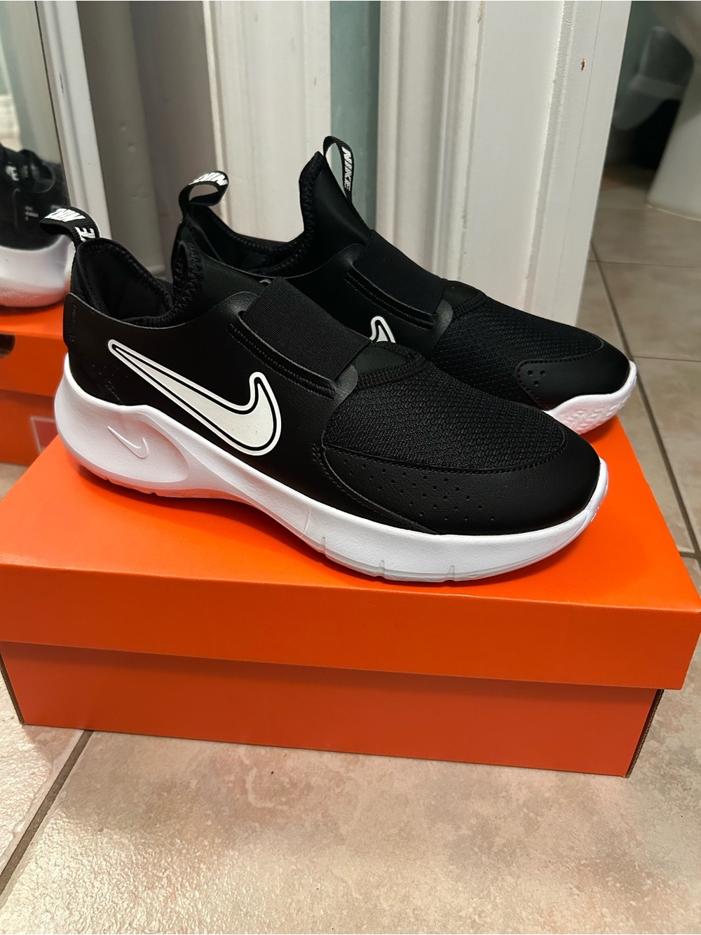 Nike Kids Black and White Slip-On Sneakers